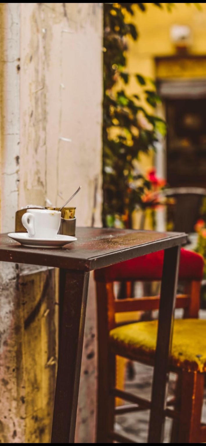 Sidewalk table, chair, scarf, and espresso