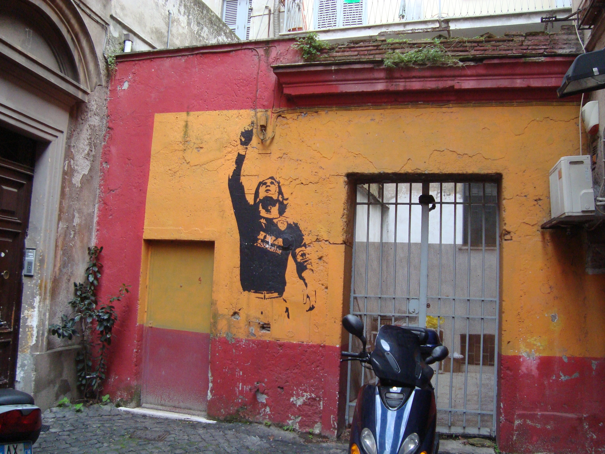 A mural of Francesco Totti on a wall in Rome's Monti district.